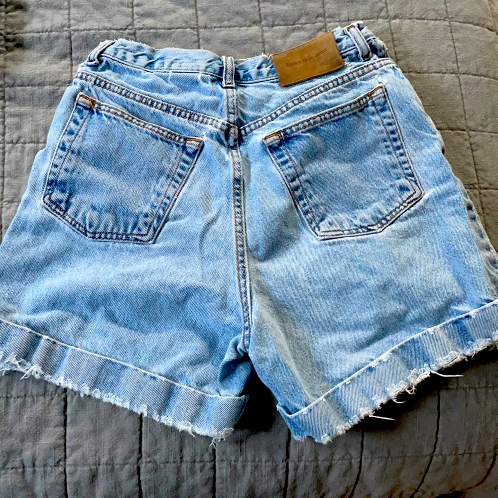 Vintage Calvin Klein stonewashed cuffed jean shorts.